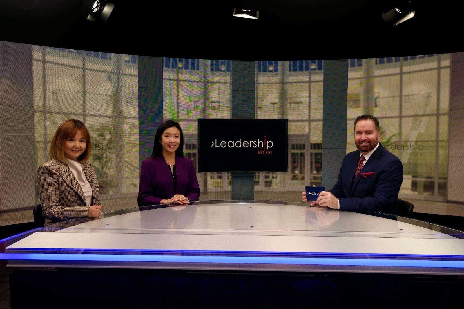 A group of people sitting at a tableAI-generated content may be incorrect.