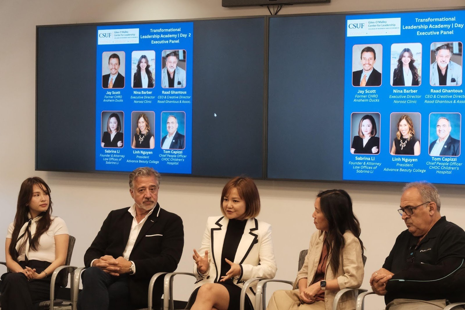 A group of people sitting in chairsAI-generated content may be incorrect.