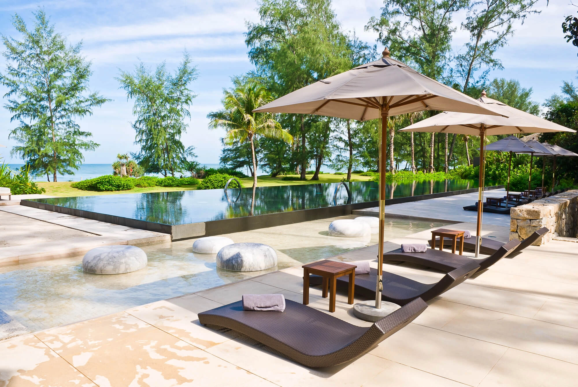 modern pool area with the best outdoor furniture in palm beach