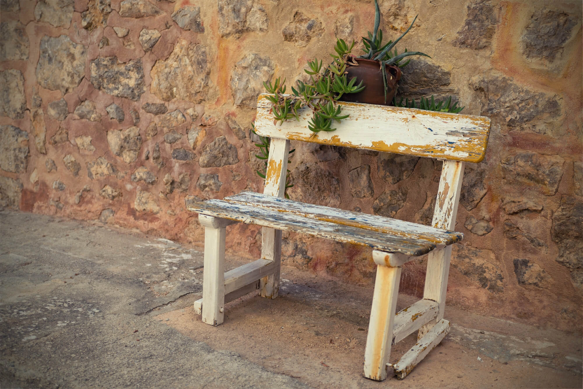 faded bench and outdoor dining furniture Palm Beach