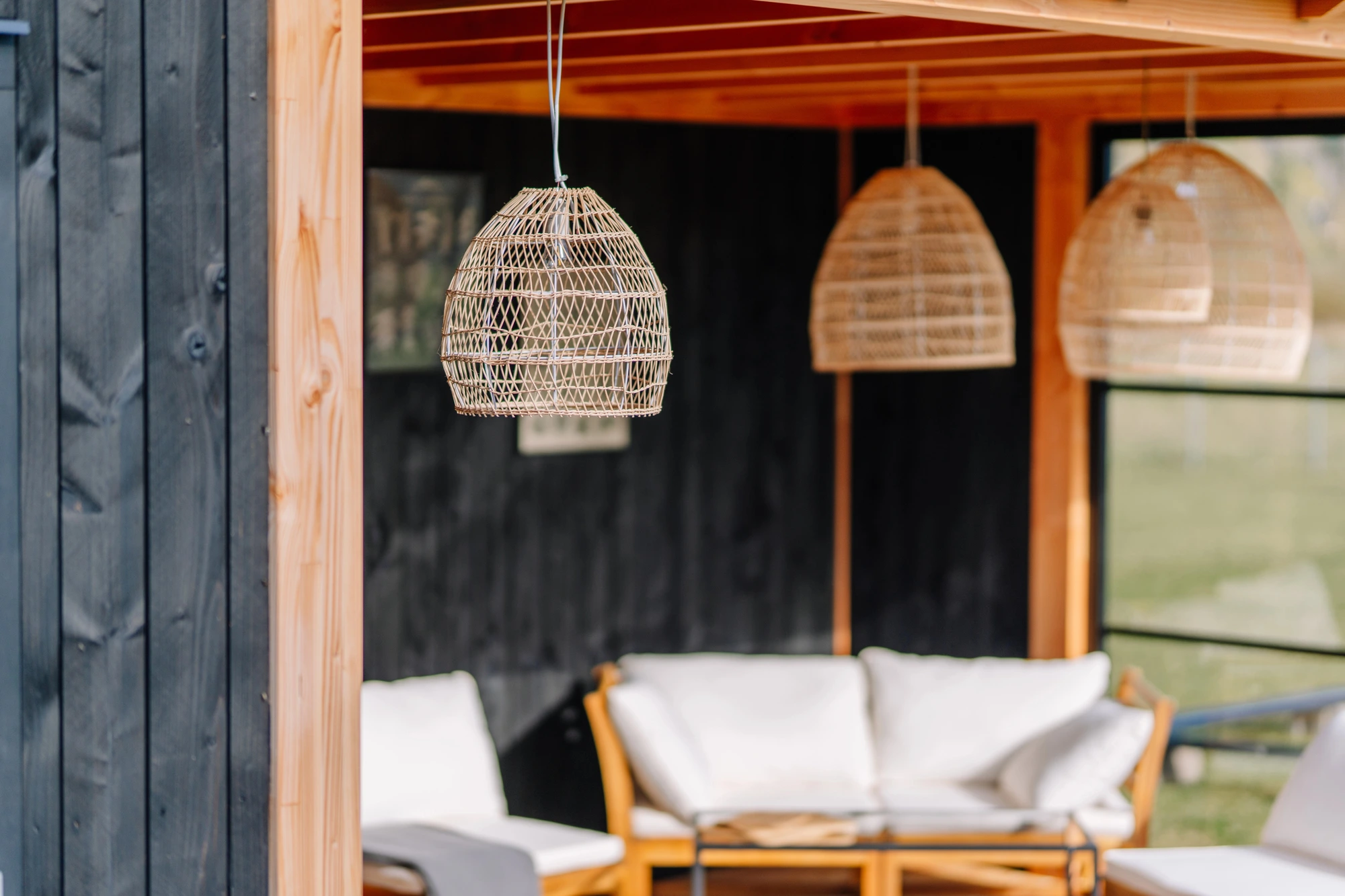 patio with an outdoor rattan pendant light