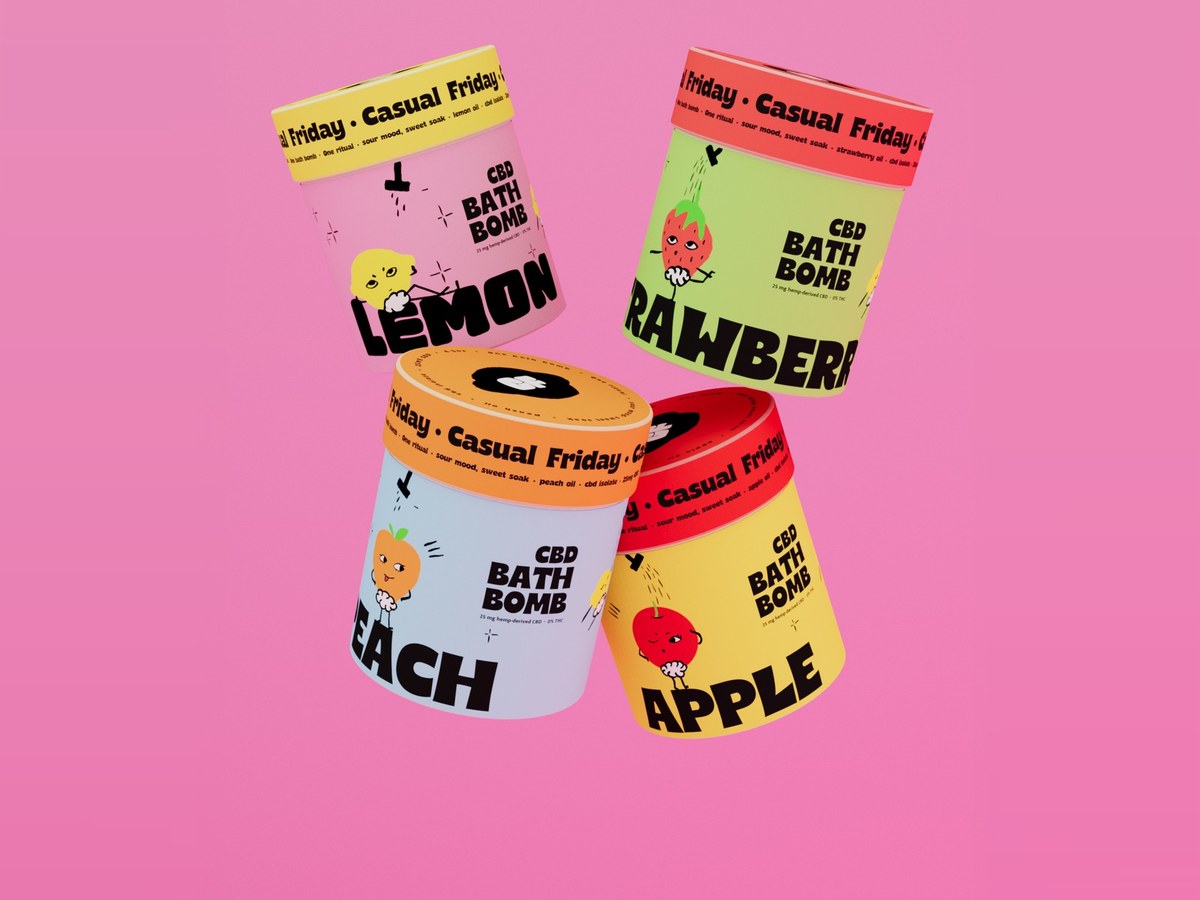 Casual Friday CBD bath bomb tubes floating on pink