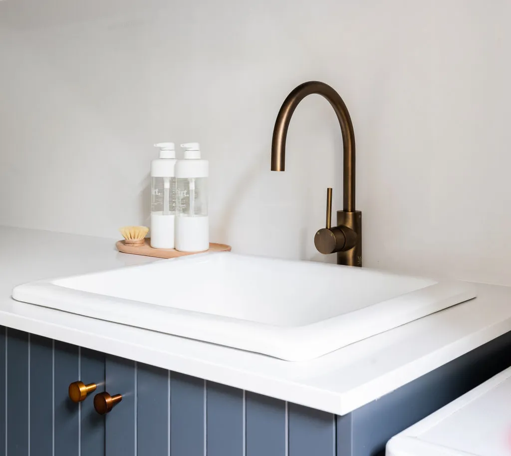 Modern laundry with tall storage cabinets