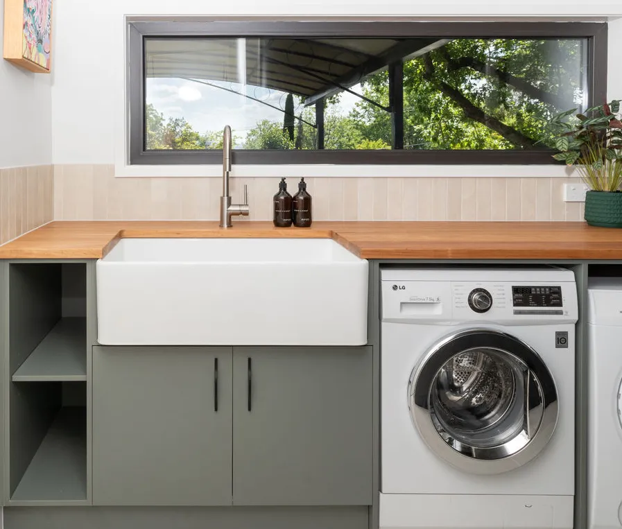 New laundry with green tiled splashback