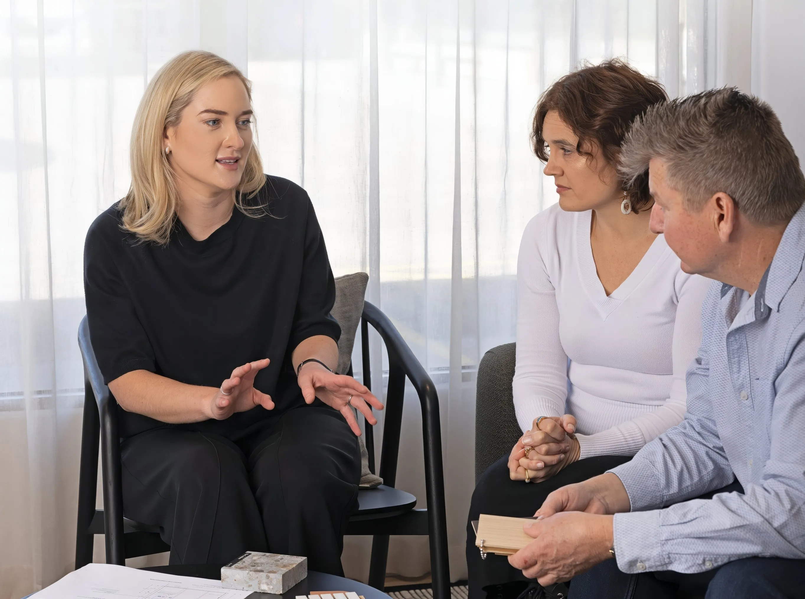 Interior designer talking to client in meeting
