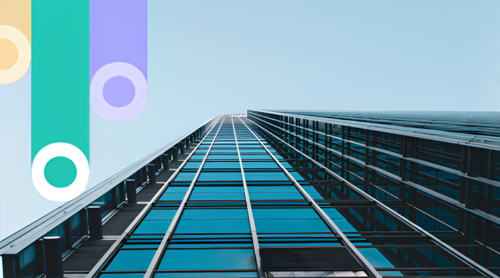 Low-angle view of a modern glass skyscraper reflecting the blue sky, with abstract colorful shapes in upper left corner.