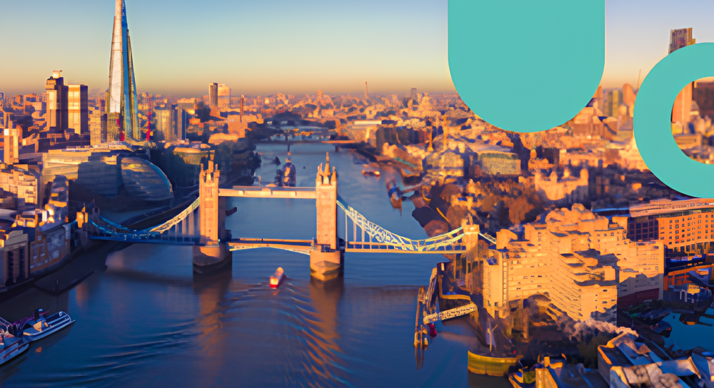 Aerial view of London at sunset showing the River Thames with the Tower Bridge spanning across it, boats moving in the water, and surrounding city buildings bathed in warm sunlight.