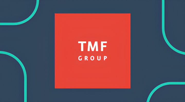 Red square with white text reading 'TMF GROUP' centered on a dark blue background with curved teal lines near the corners.