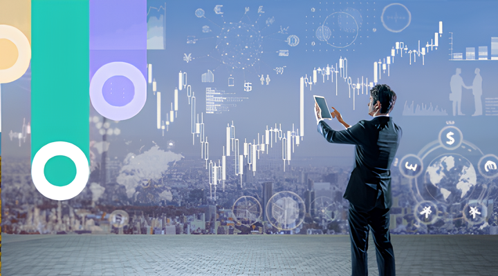 Businessman in a suit holding a tablet and interacting with a transparent digital screen displaying financial charts, graphs, and global currency symbols over a cityscape background.