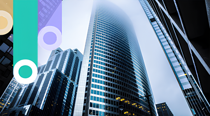 Skyscrapers with modern glass facades viewed from street level, with the tallest building disappearing into fog at the top.