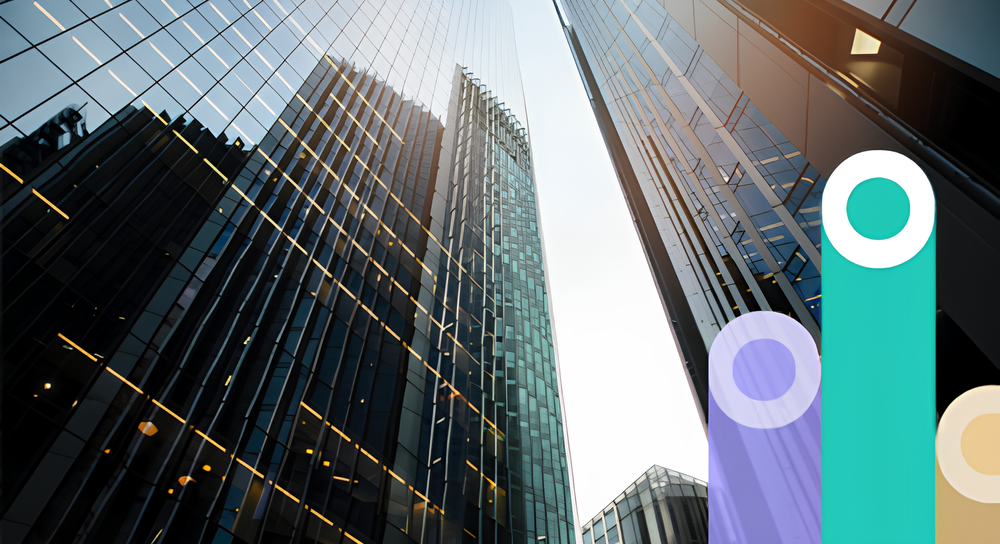 Looking up at tall modern glass skyscrapers with reflections of lights and the sky between the buildings, overlaid with semi-transparent colorful vertical rounded bars on the right side.