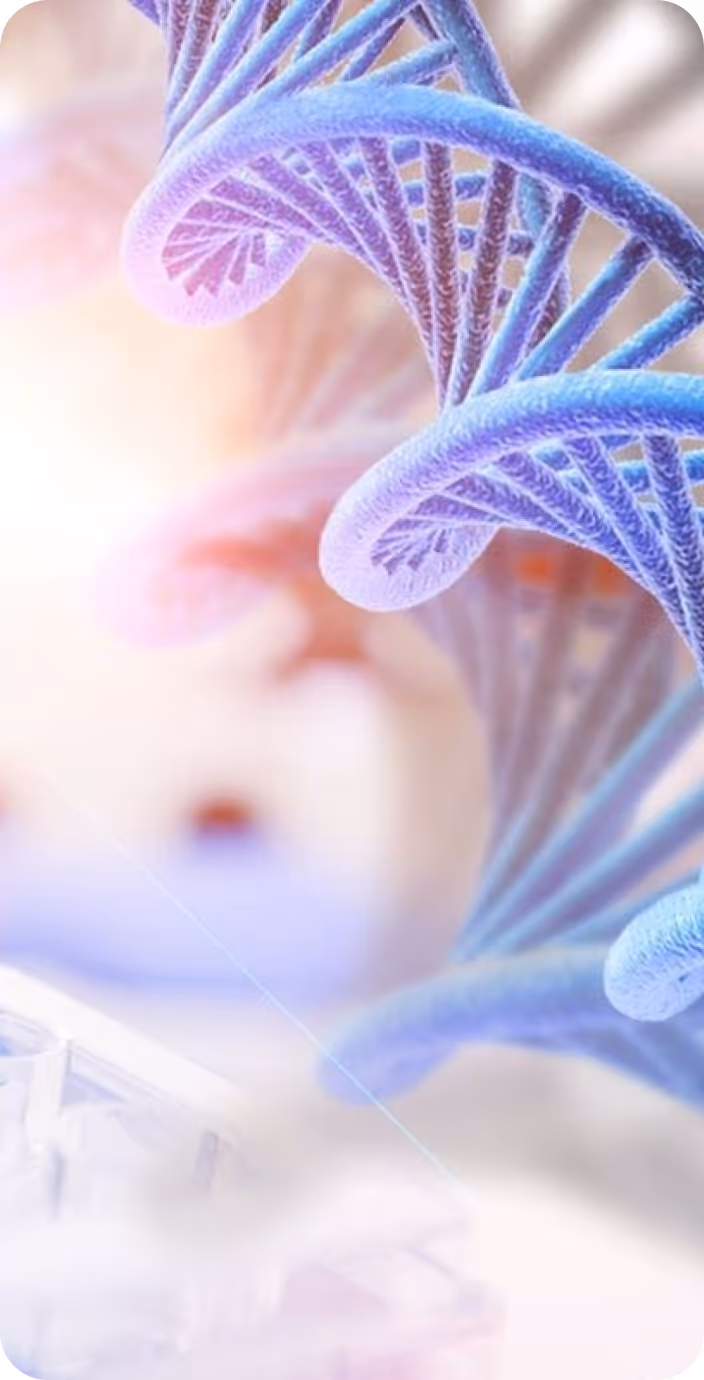 Male doctor wearing glasses and a white coat with a stethoscope around his neck, sitting at a desk with hands clasped.