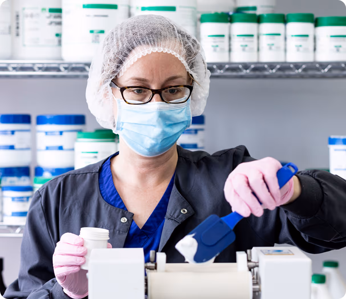 Group of medical professionals in lab coats discussing with tablets and charts, smiling and collaborating.