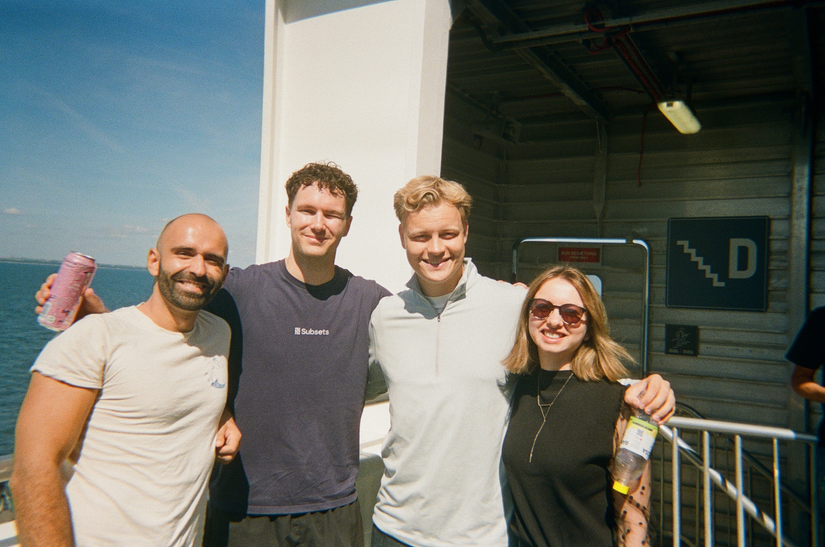 Four Subsets team members by the waterfront