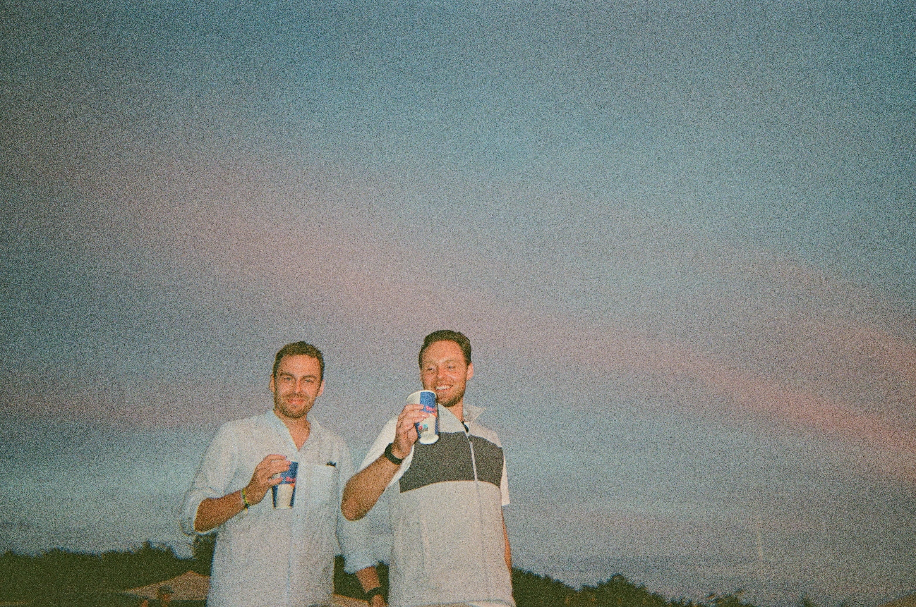 Two Subsets team members outdoors at sunset