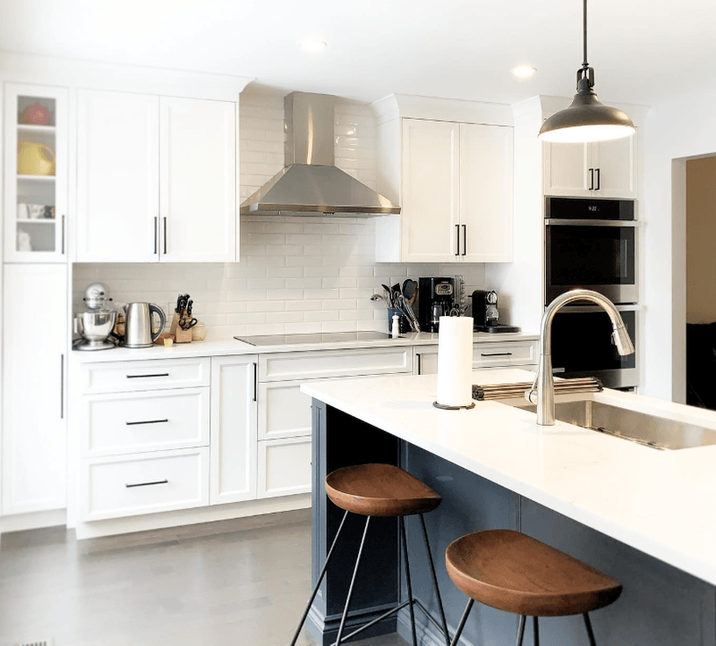 White kitchen remodel with a two-tone island in Ottawa