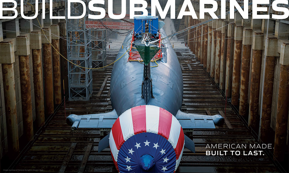 Submarine in dry dock with American flag on bow