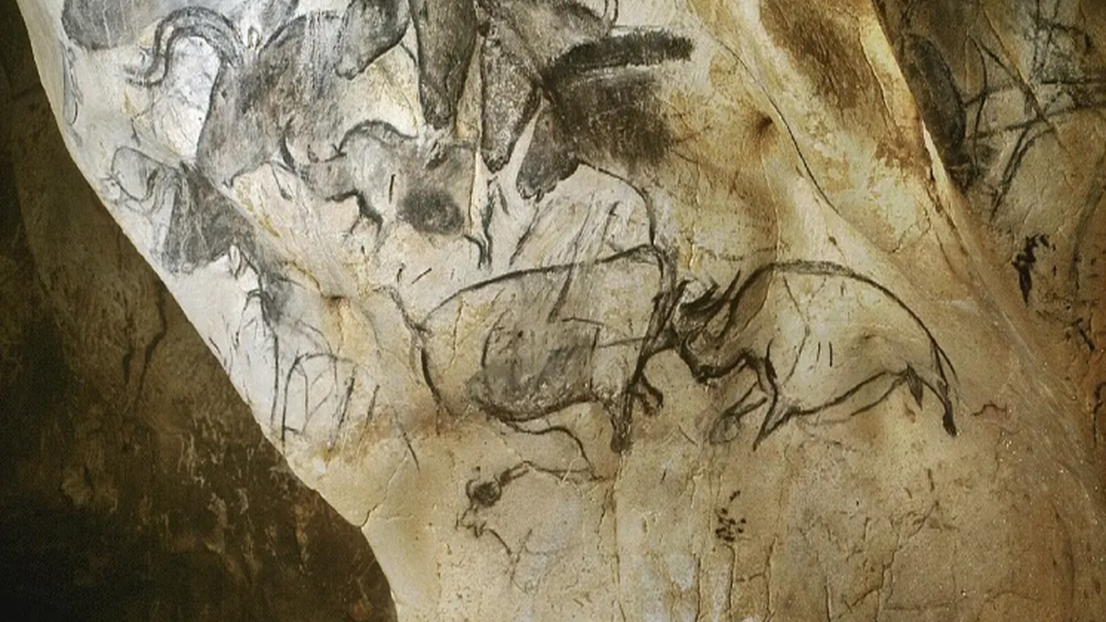 Grotte Chauvet-Pont d’Arc cave paintings in France, featuring prehistoric animal artwork, with the title “Embracing Our Humanity & Finding Balance with AI” overlaid in white text and orange accent lines.