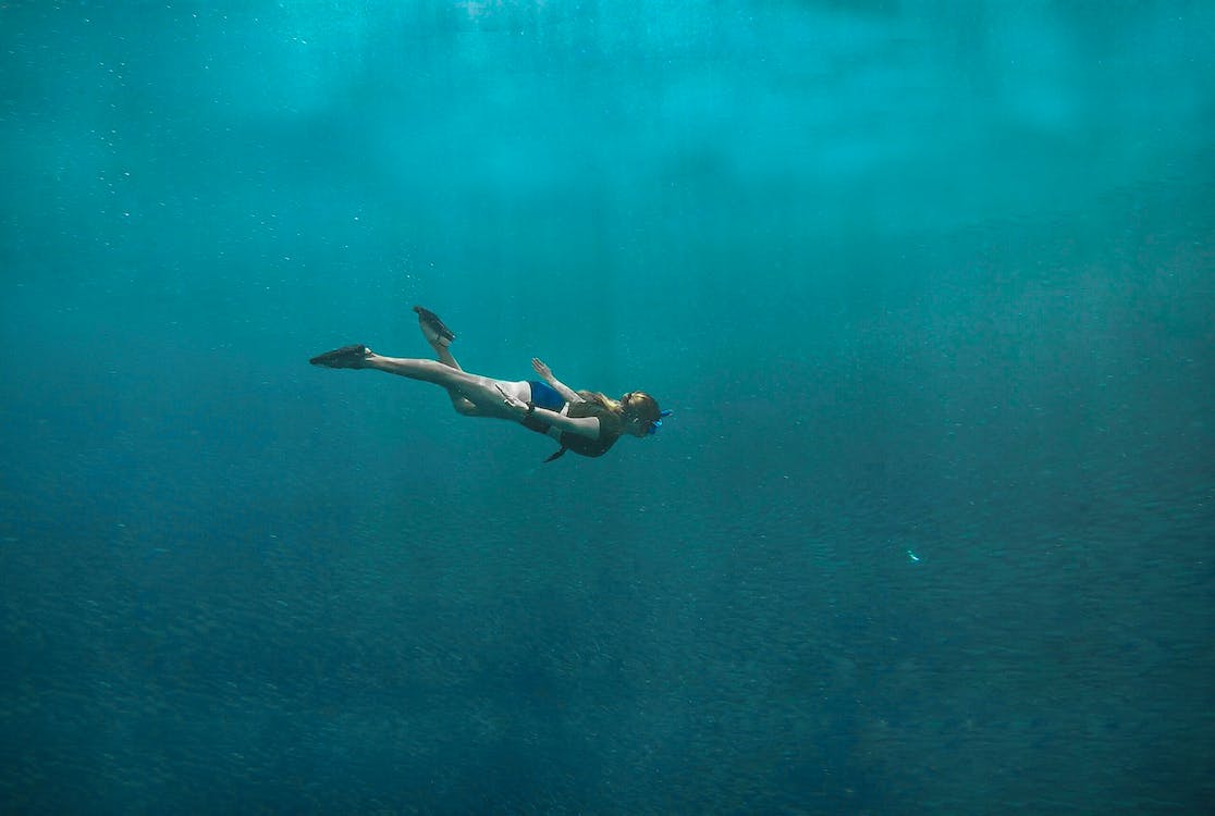Free Photo of Woman Swimming Underwater Stock Photo