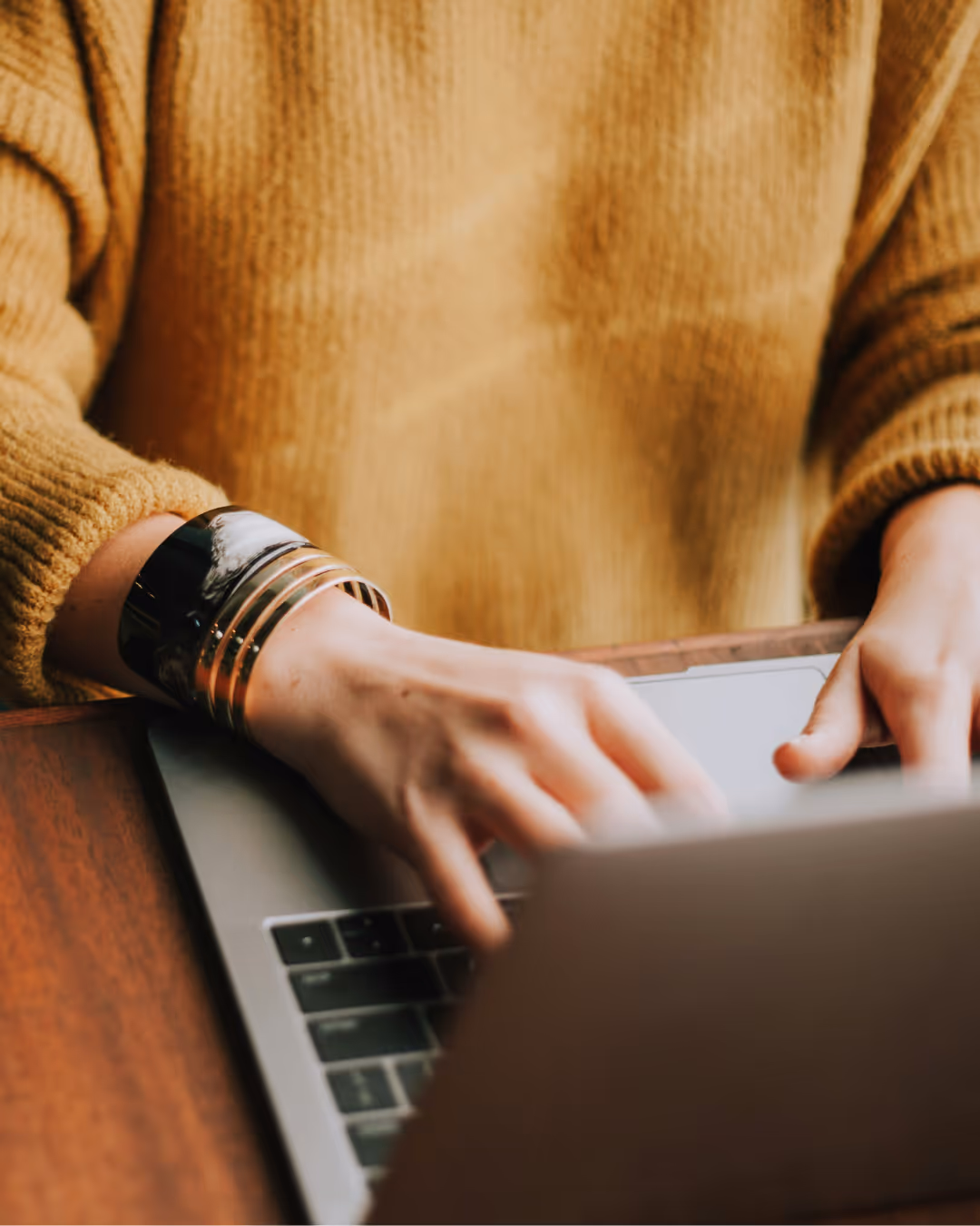 Someone typing on a computer