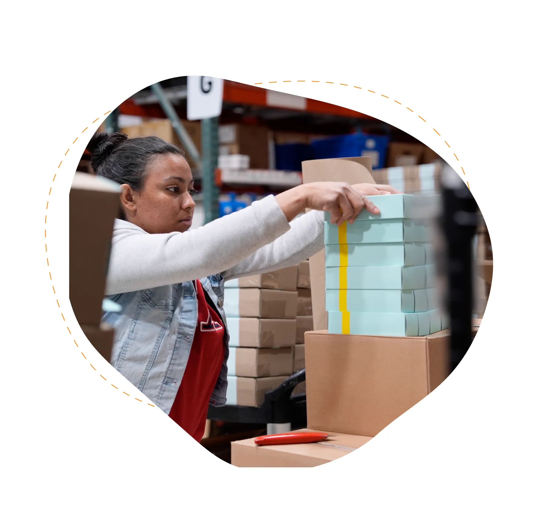 Woman stacking boxes.