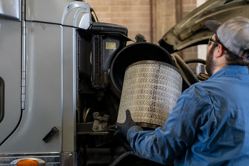 Mechanic replacing an air filter