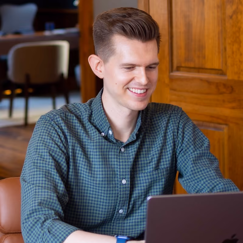 Cody Nichelson, co-founder of Fully Financial, works on in his laptop at his office in Downtown Athens, GA.