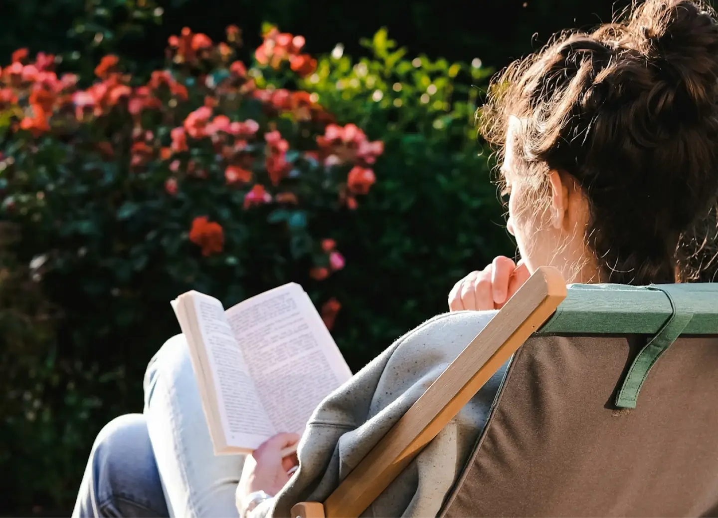 Woman reading a novel outdoors