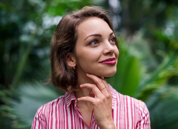 Young woman with laser corrected eyes smiling outdoors