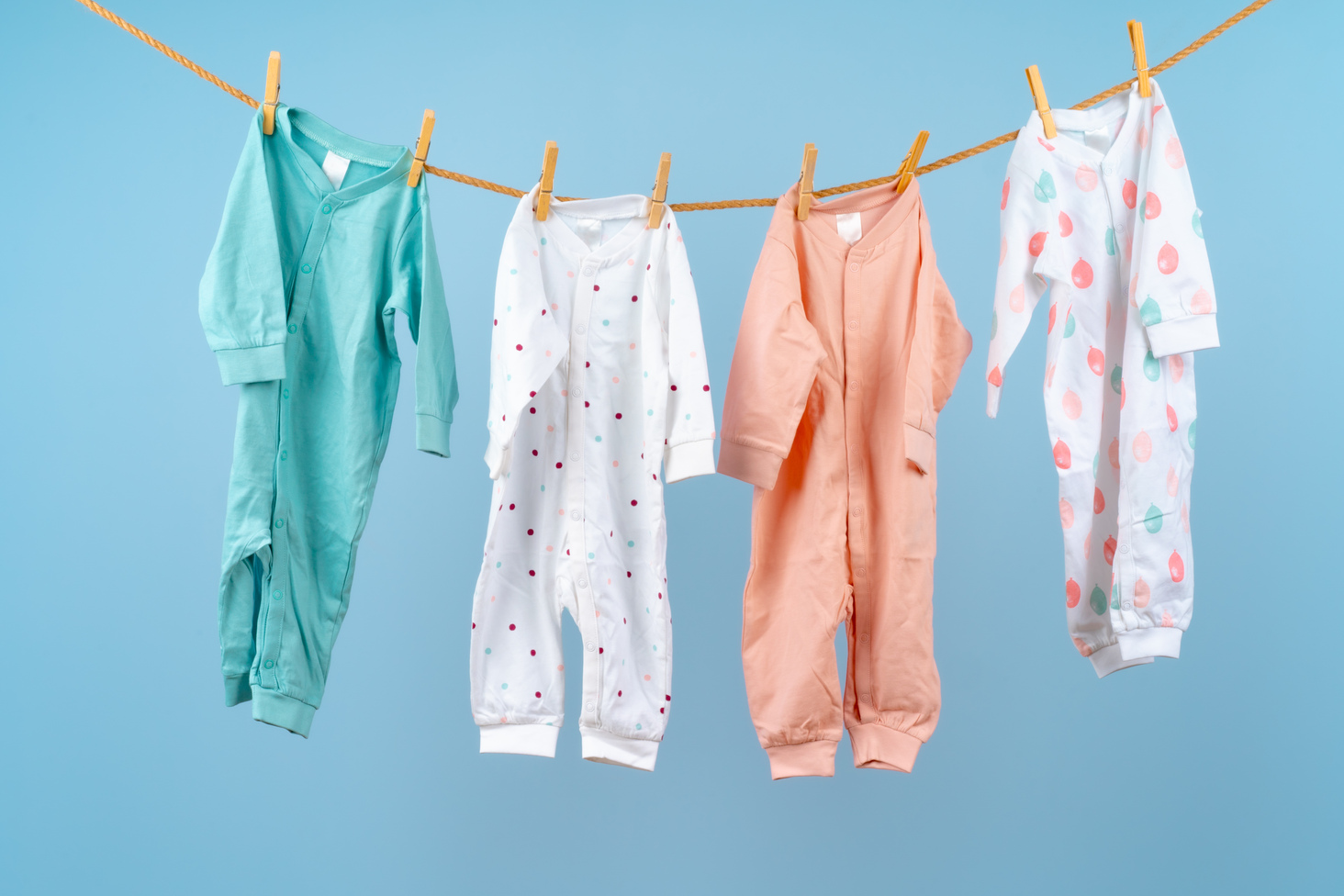 freshly cleaned clothes hung and clipped onto a rope