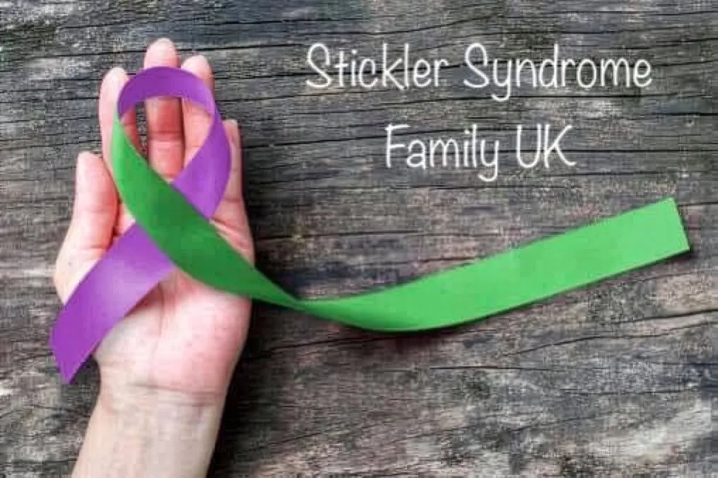 Stickler Syndrome Family UK Facebook image of a hand with purple and green ribbon