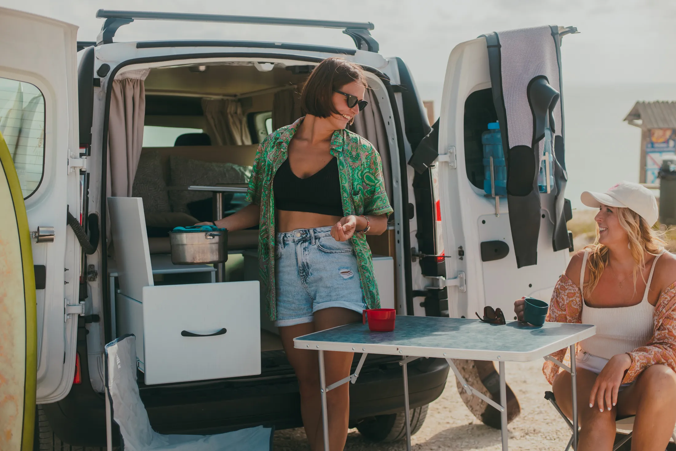 friends talking at the back of van
