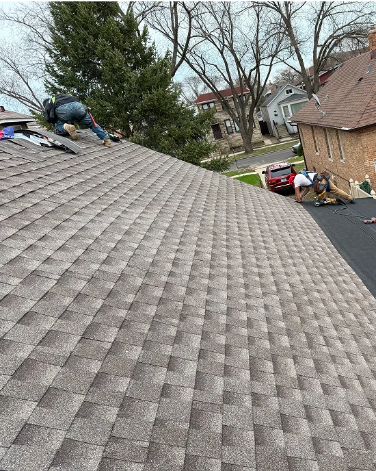 Shingle and Flat Roof Replacement with Chimney Repairs Project in Progress in Elmwood Park
