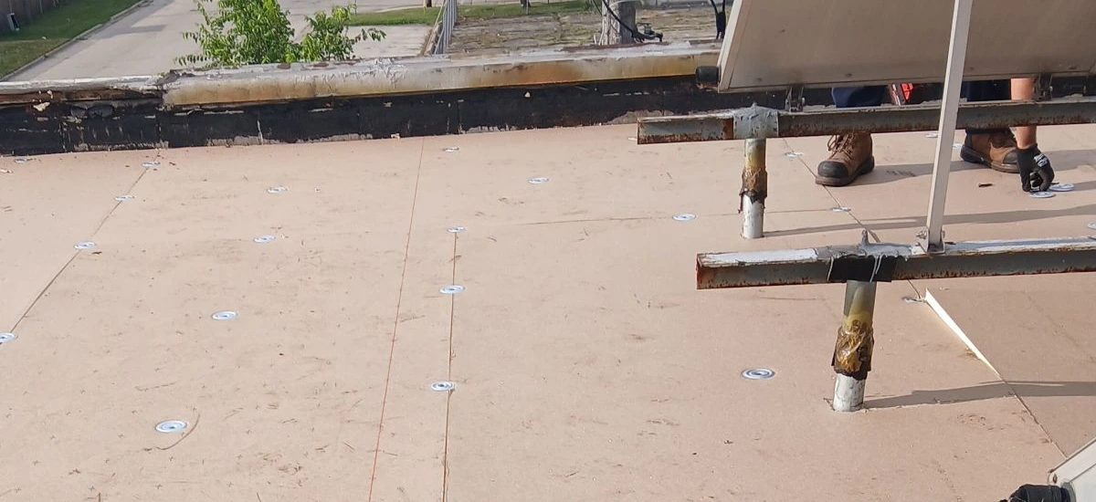 Prepared Commercial Roof Deck with New Substrate Installation in Progress