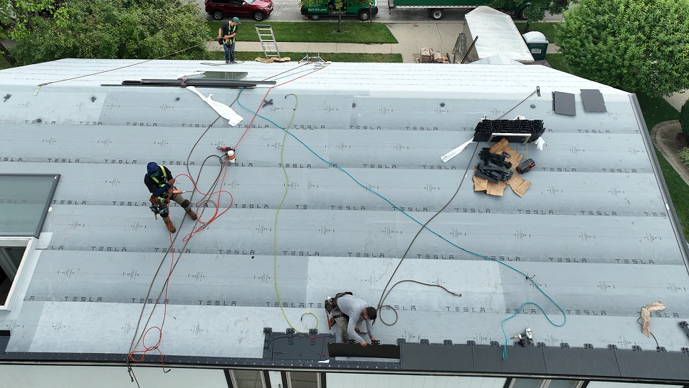 Roofers working on new roof installation