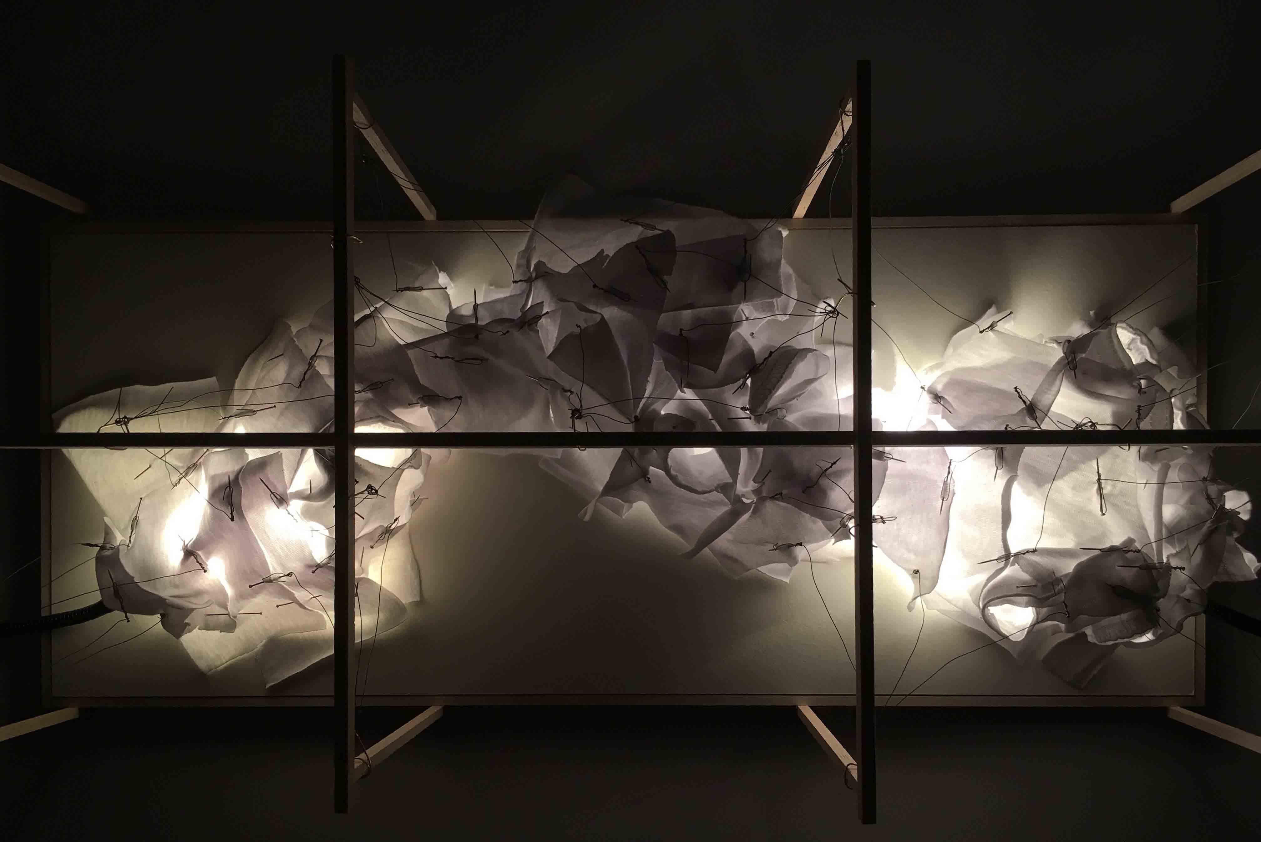 A lit model photograph of an exhibition design.