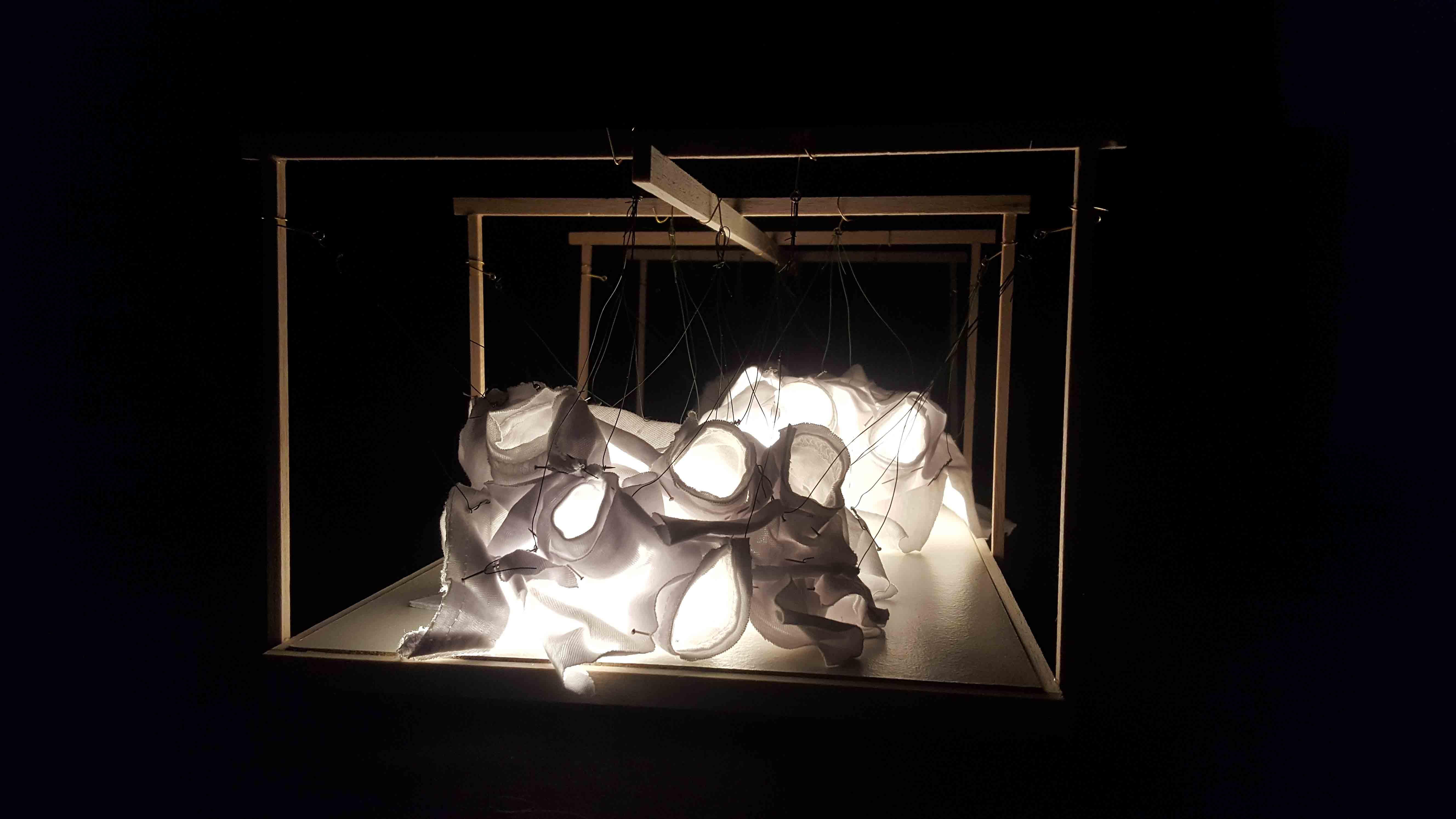 A lit model photograph of an exhibition design.