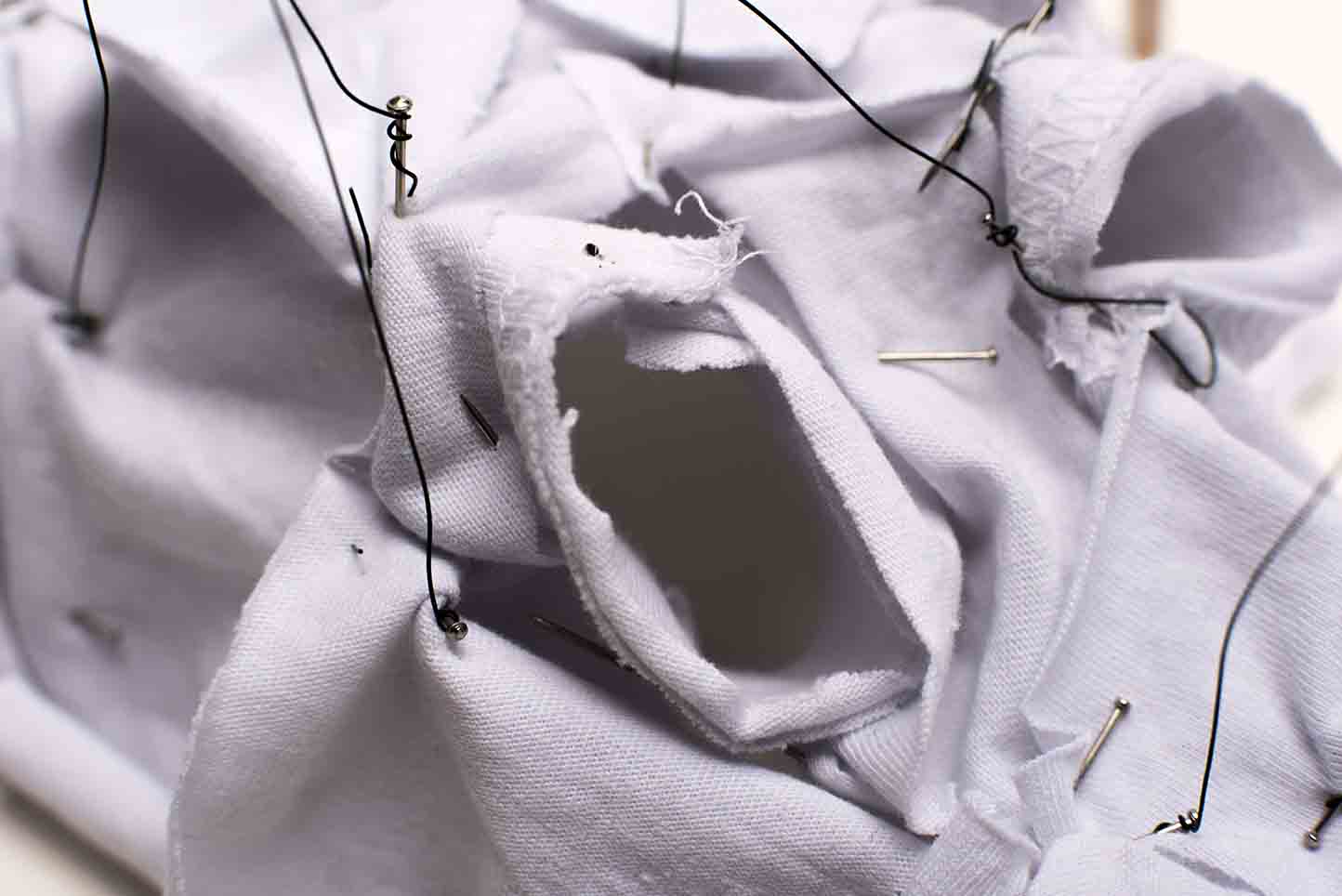 A detail photograph of a hanging fabric exhibition model.