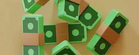 Stacks of green play money bills bound with brown paper bands arranged on a beige surface.