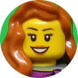 Smiling LEGO minifigure woman with long wavy brown hair and purple top.