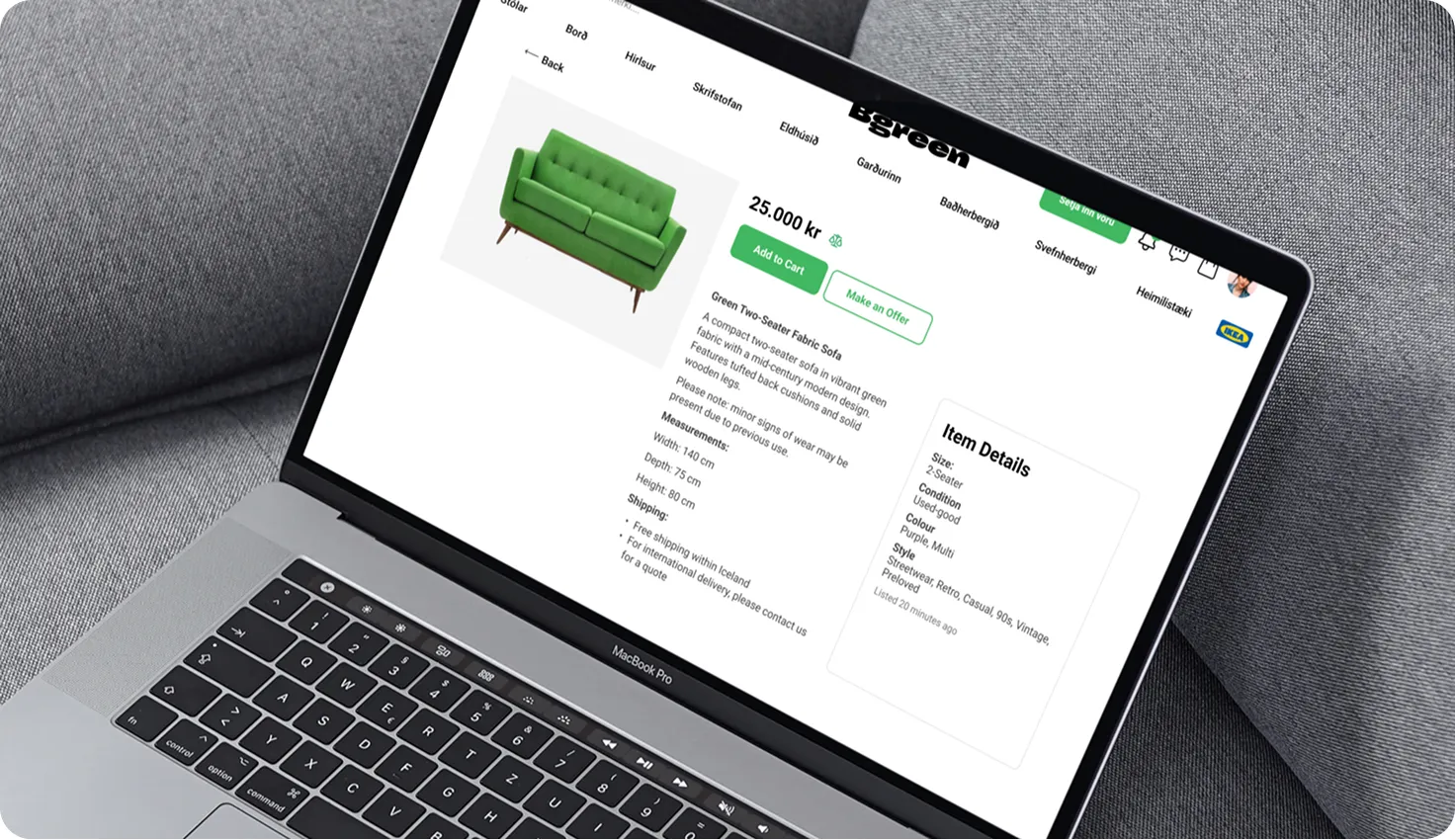 Laptop screen showing an online listing for a green two-seater fabric sofa priced at 25,000 kr with details and buttons to add to cart or make an offer.