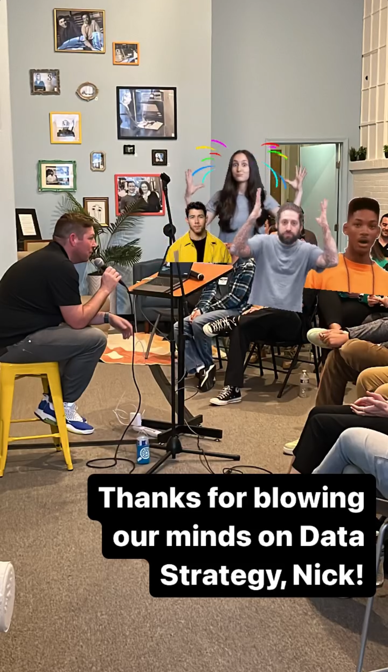 smartphone screenshot of Nick White sitting on a stool speaking to an audience, edited to create a classroom-like setting and include celebrity memes of minds being blown