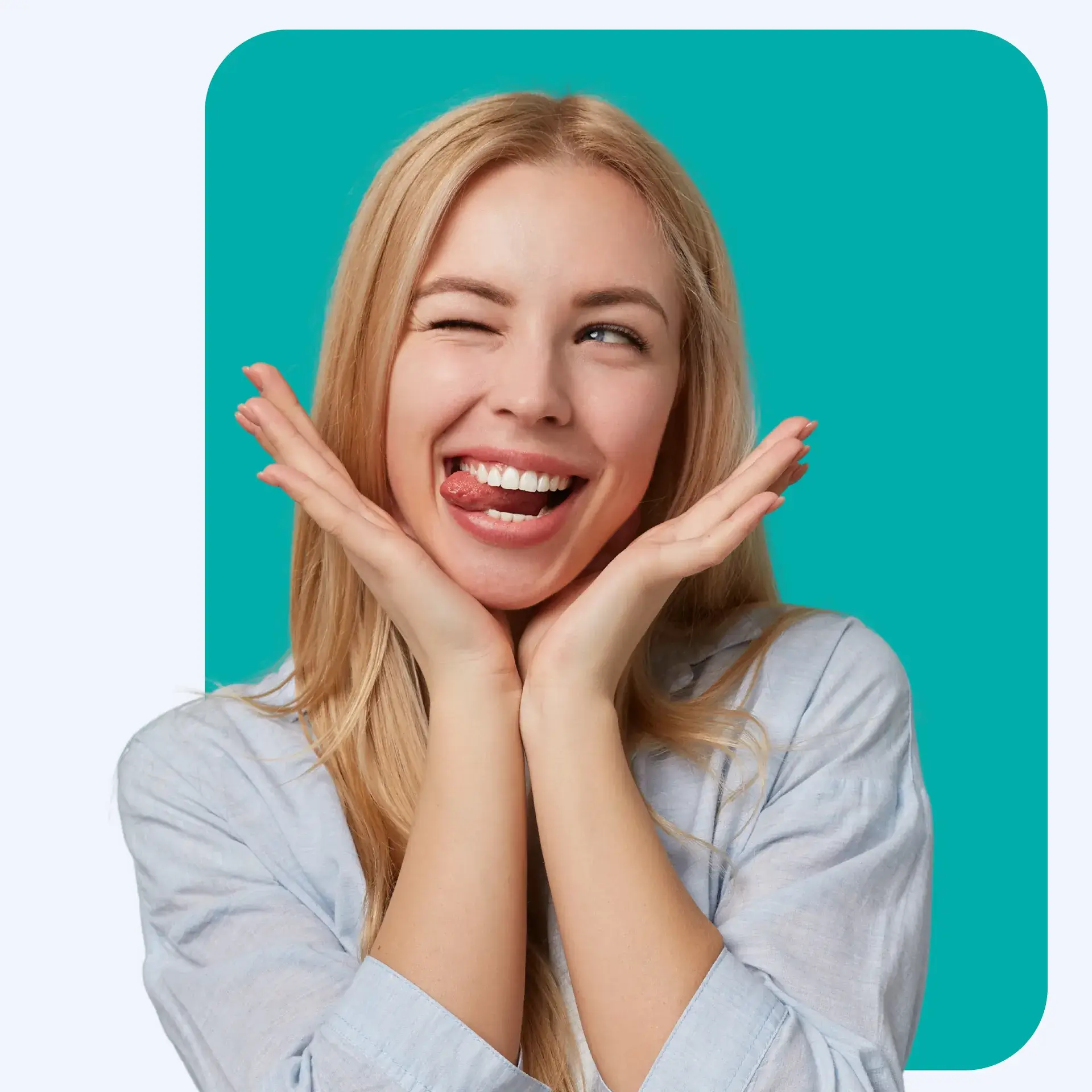Woman smiling while biting her tongue