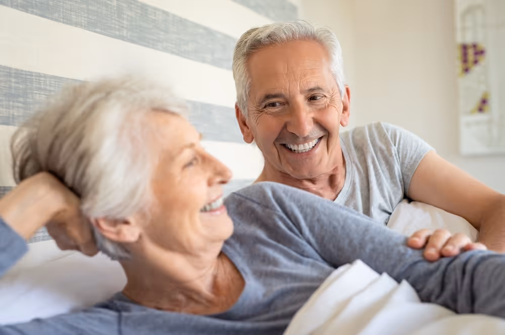 woman waking up happy with sleeping mask