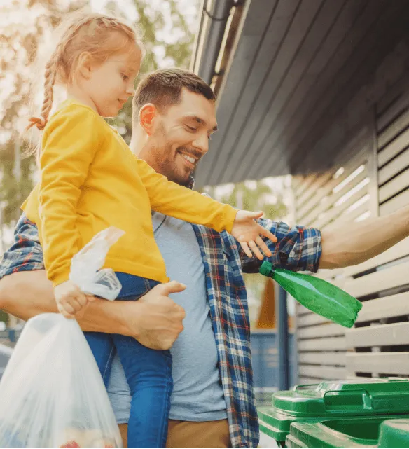 Stacked cardboard boxes on a recycling bin for commercial waste disposal services.