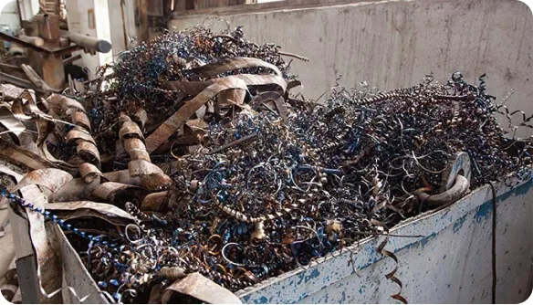 Stacked cardboard boxes on a recycling bin for commercial waste disposal services.