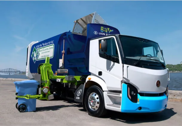 Waste service representative with tablet standing by a commercial trash dumpster.