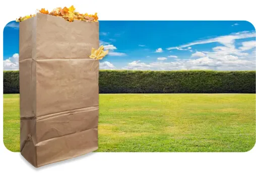 Large yard waste bag filled with leaves for lawn waste removal and leaf pick up.