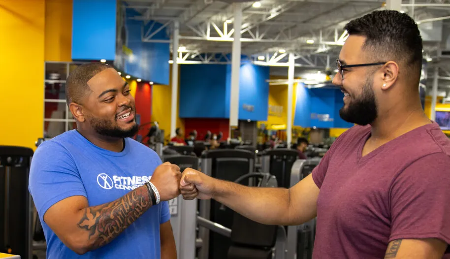Fitness Connection employee greeting a member