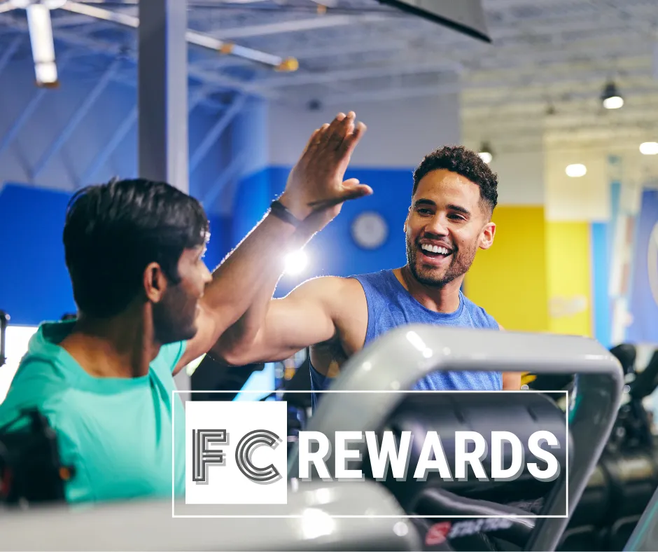 Two men high-fiving after using FCRewards program